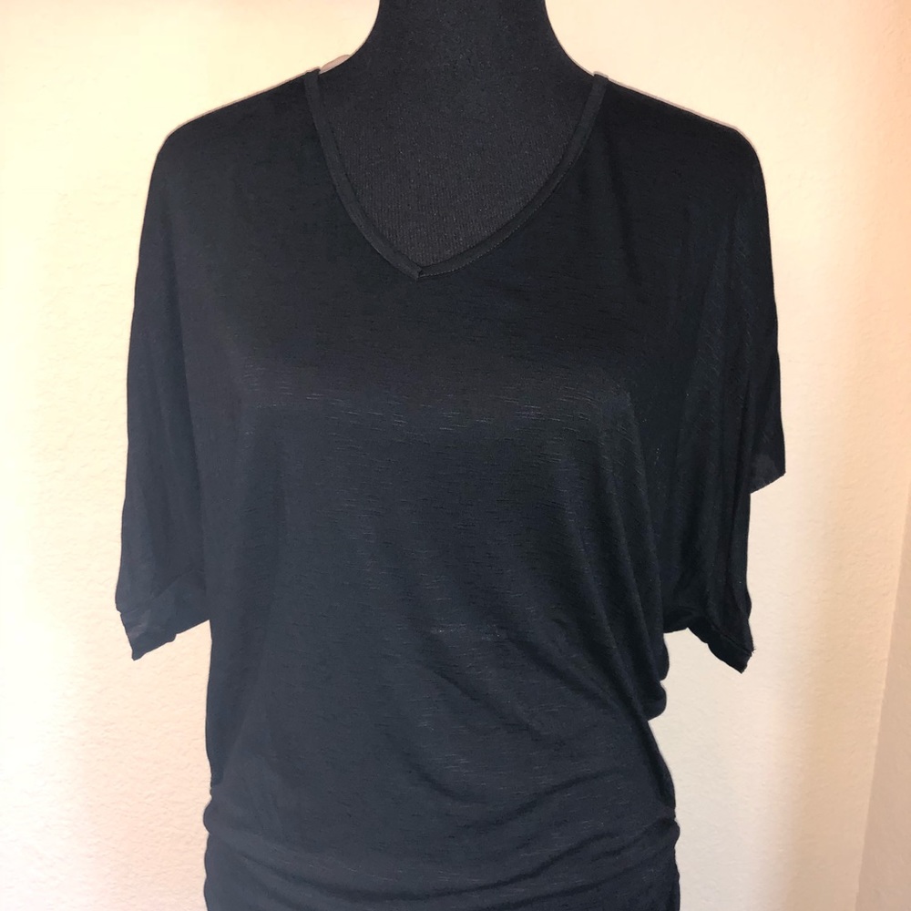 Loose fit black top.